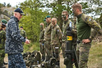 Vice Adm. James G. Foggo, III, speaks with Finnish Coastal Rangers in BALTOPS Excercise. UTO_SWEDEN JUNE 12, 2016